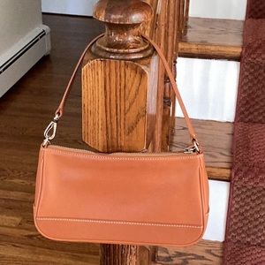 Coach leather mini/ wristlet bag, 8 3/4” x 4 3/4” zip closure, zip inside pocket